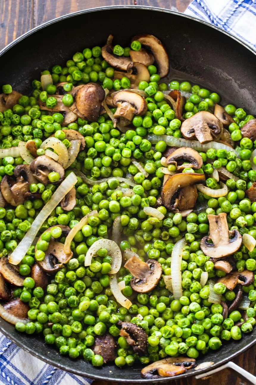 Buttered Peas and Mushrooms in a large skillet
