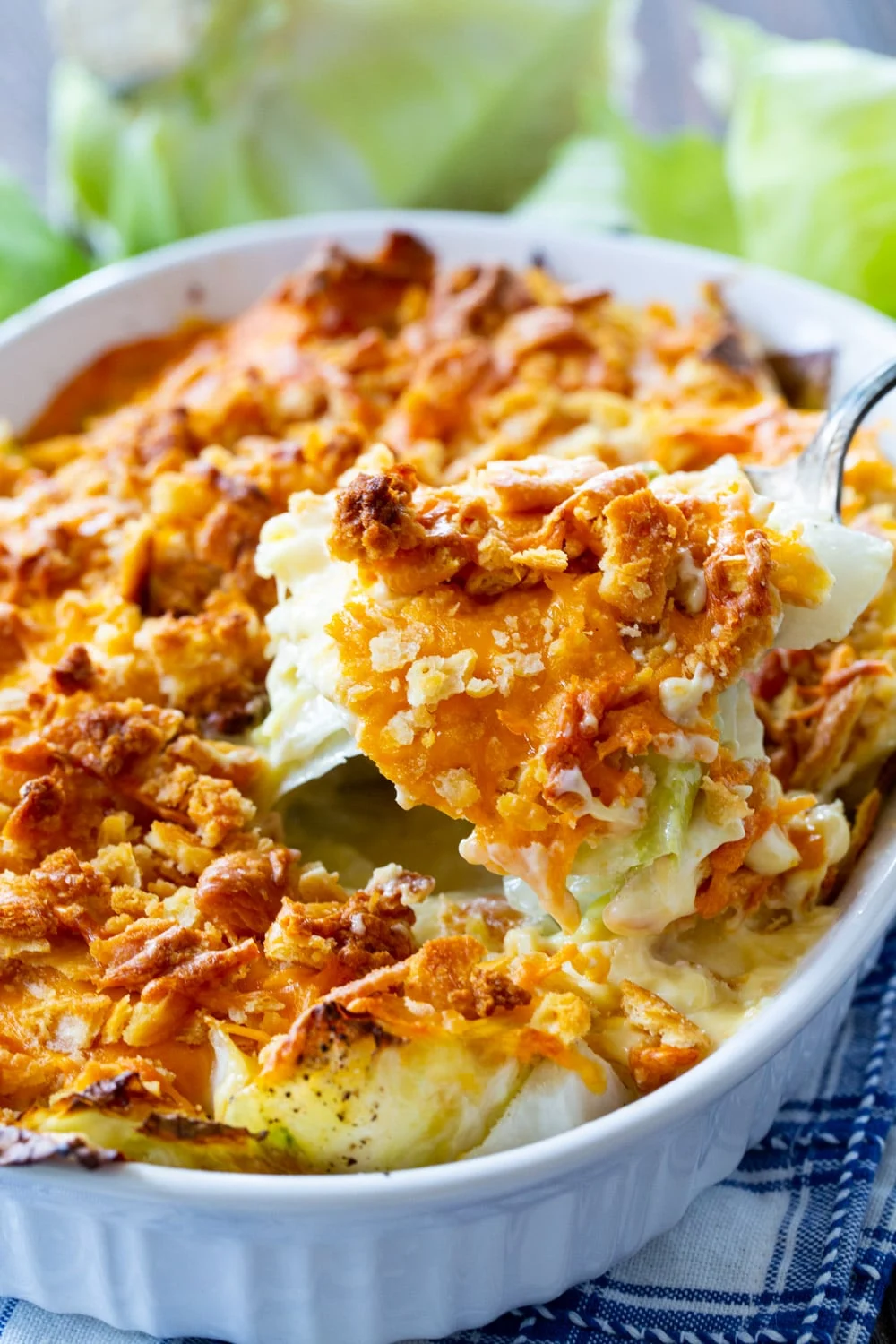 Spoon scooping Old-Fashioned Cabbage Casserole.