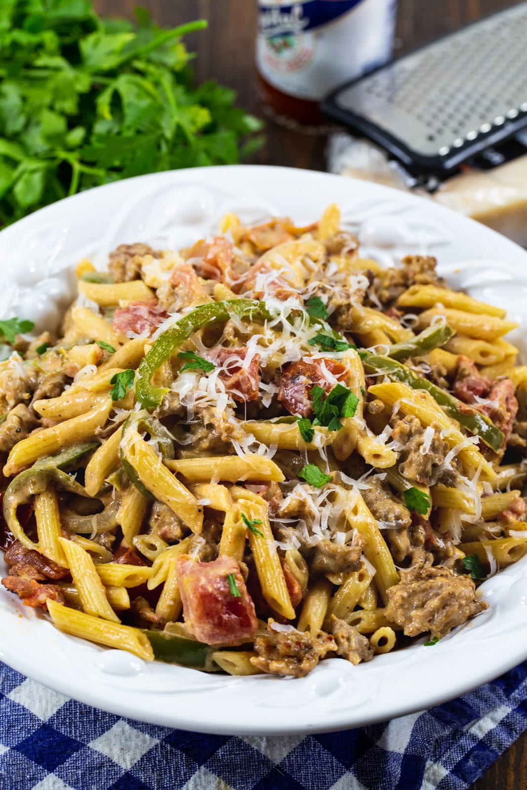 Cajun Pasta in a bowl and a bunch of parsley.