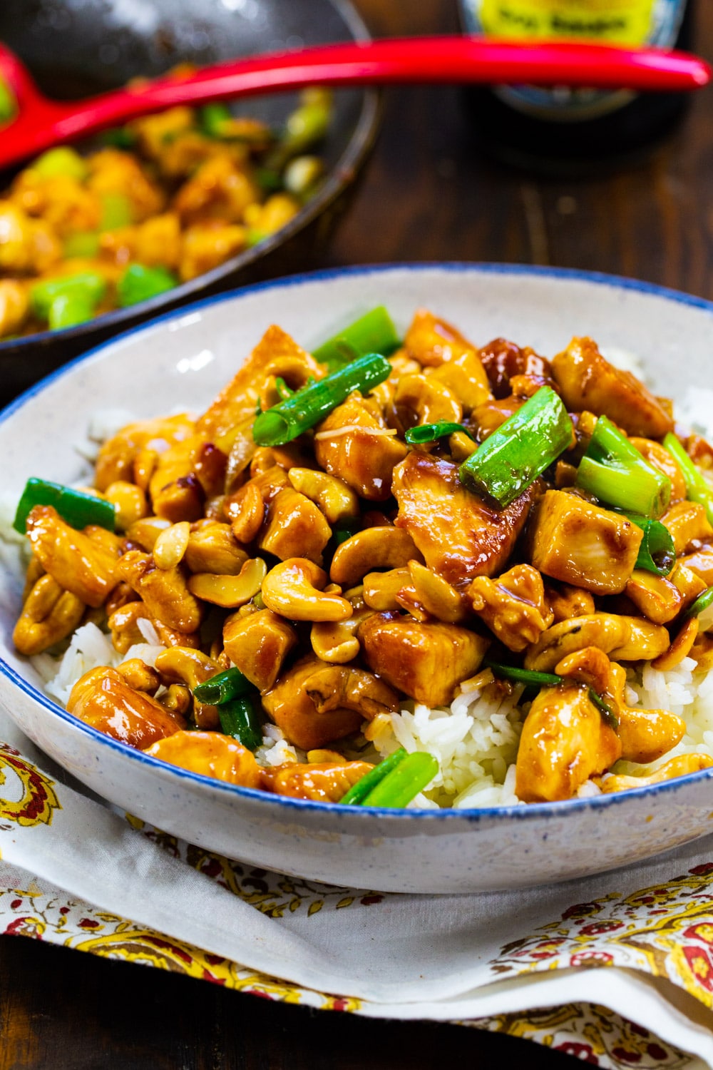 Cashew Chicken over white rice in a bowl.