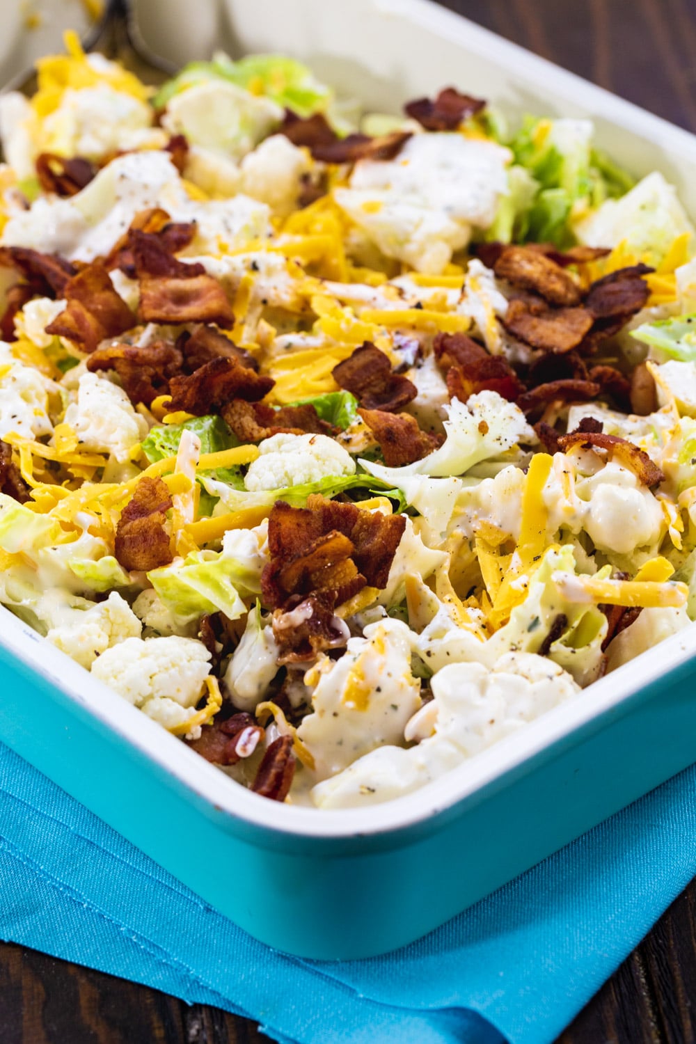Bacon and Ranch Cauliflower Salad in blue 9x13-inch pan.