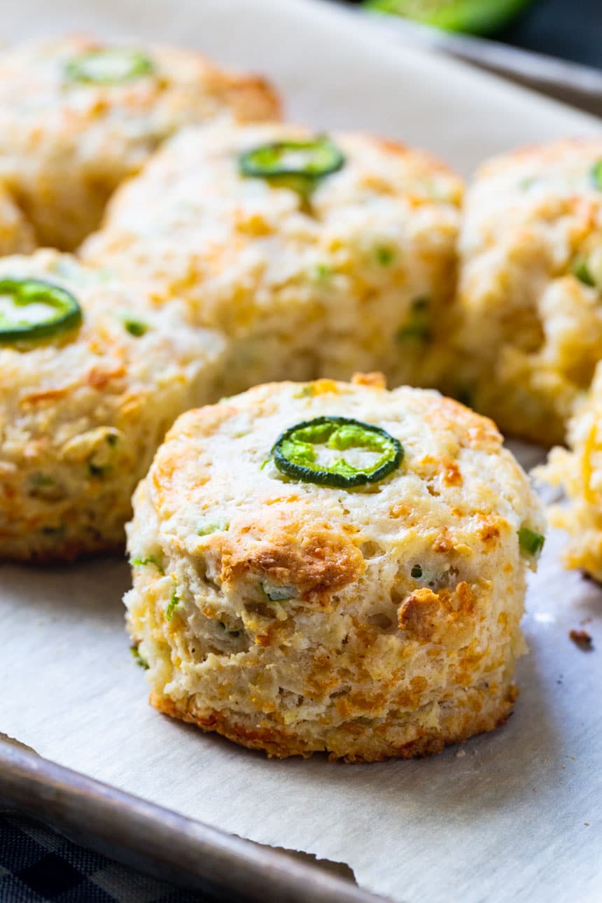 Jalapeno Cheddar Biscuits topped with jalapeno slice.