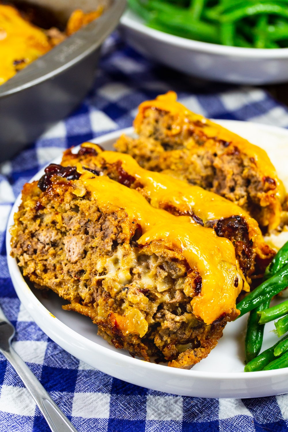 Three slices of Cheesy Chipotle Meatloaf on a plate.