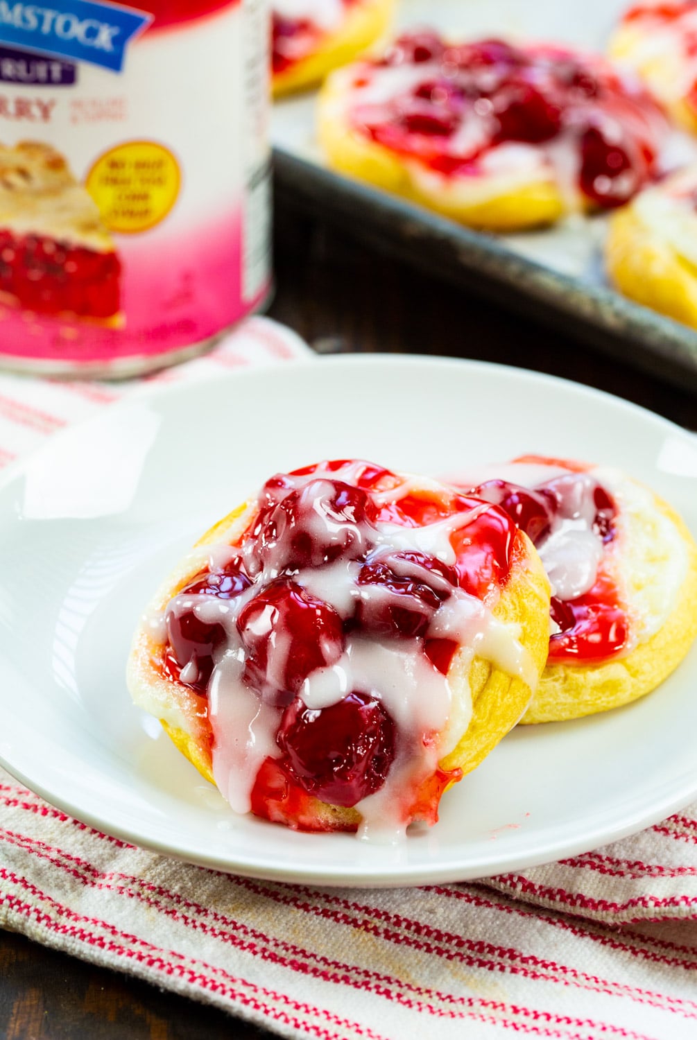 Two danishes on a plate.