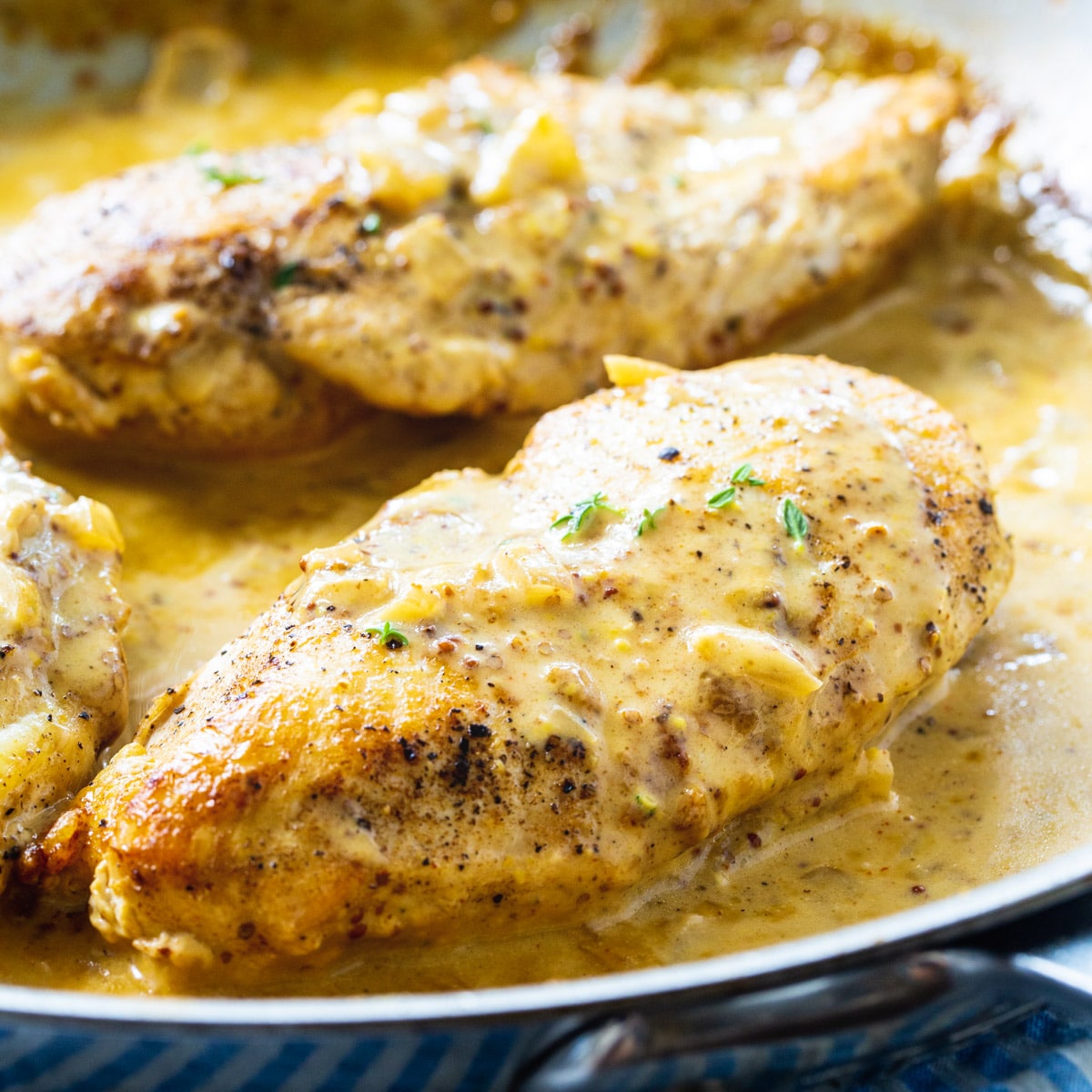 Chicken with Creole Mustard Sauce in a skillet.