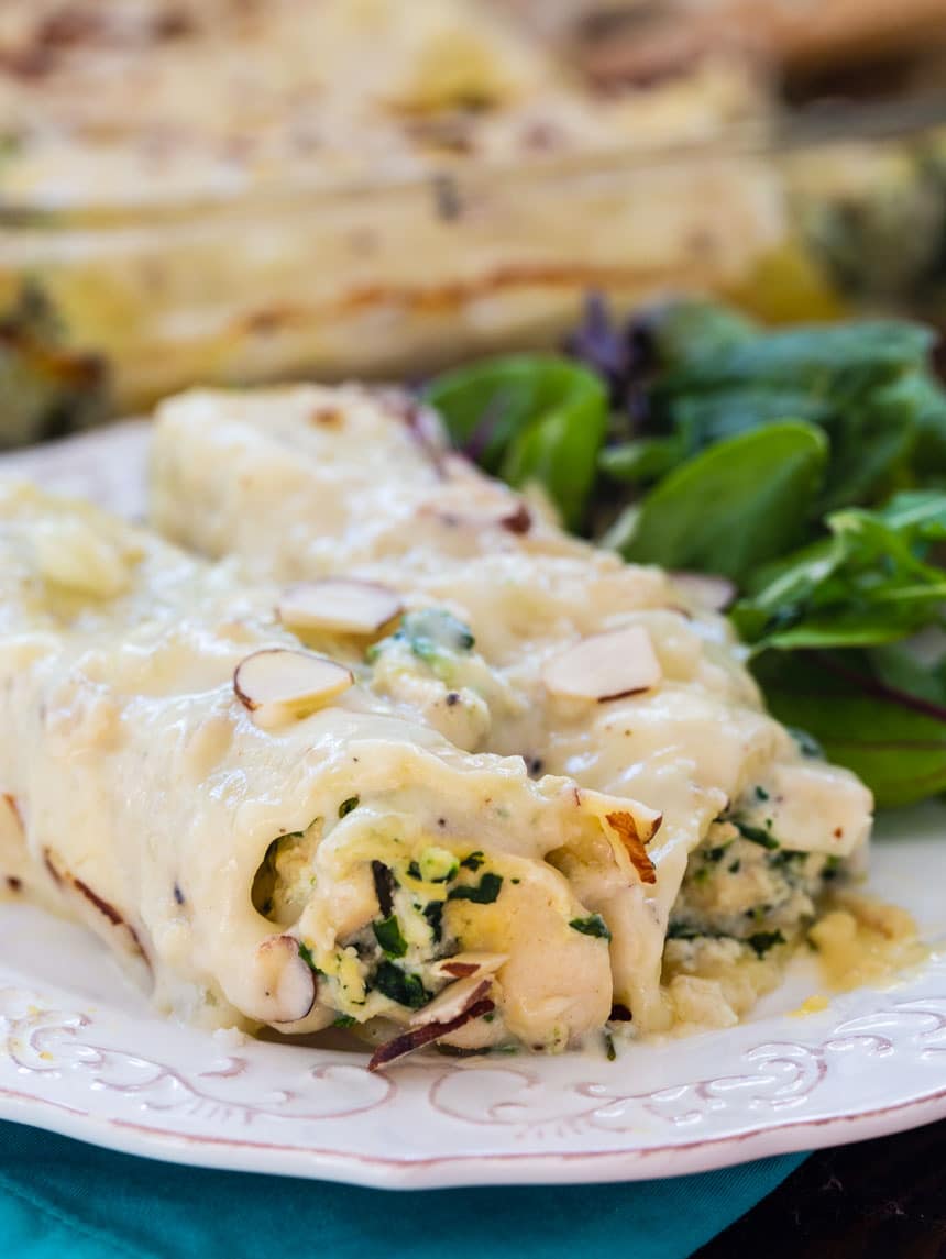 Creamy Chicken Manicotti on a plate with green salad
