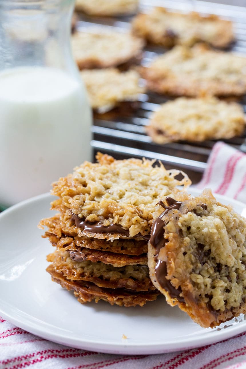 Chocolate Florentine Cookies on plate with jug of milk.