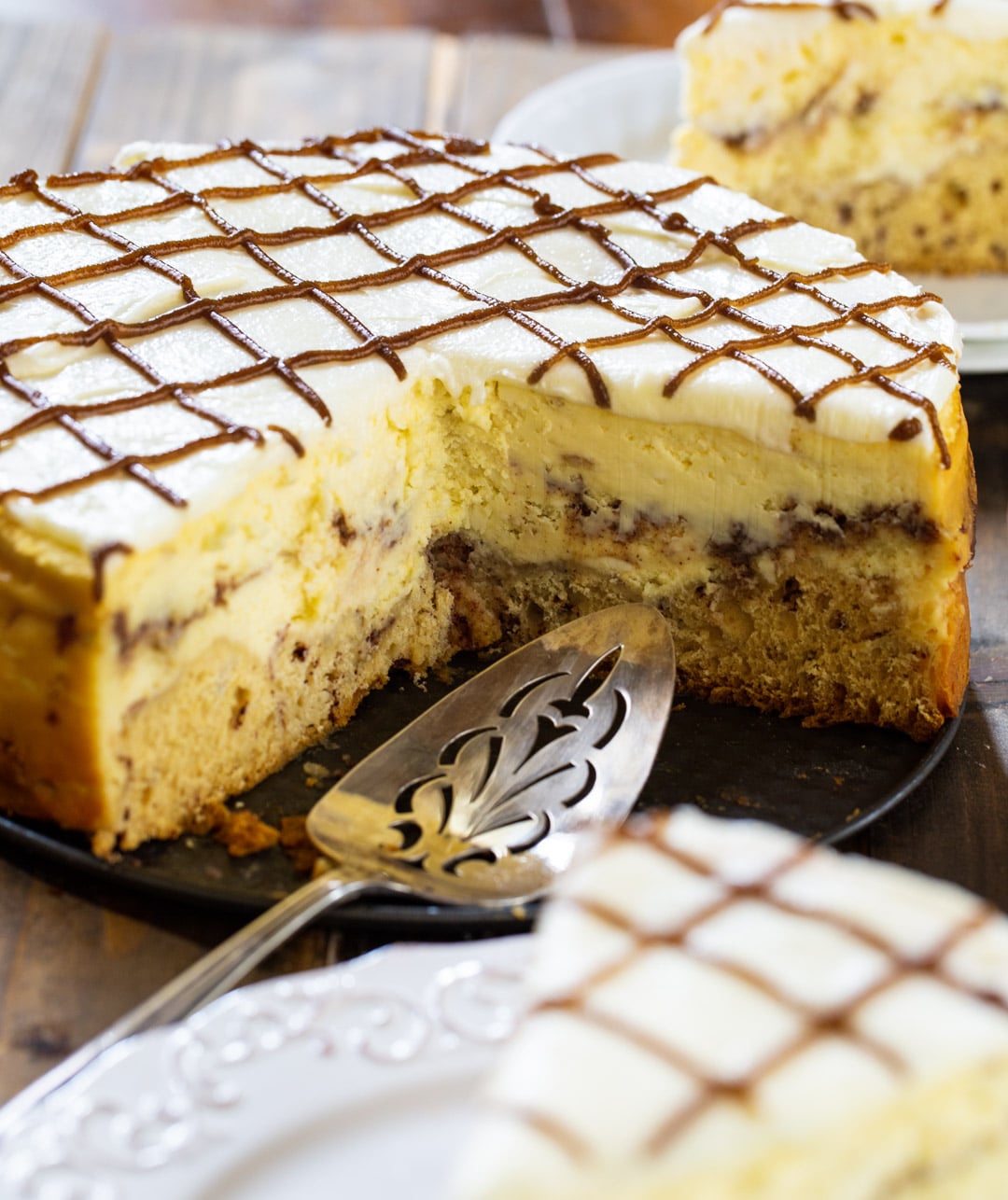 Cheesecake with sevearl pieces cut out.