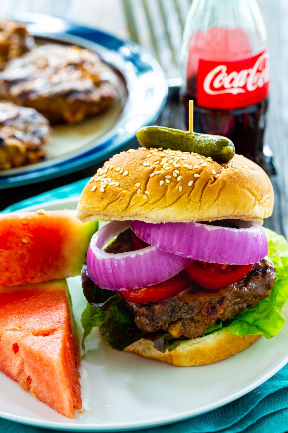 Cola Burger on a plate with watermelon.