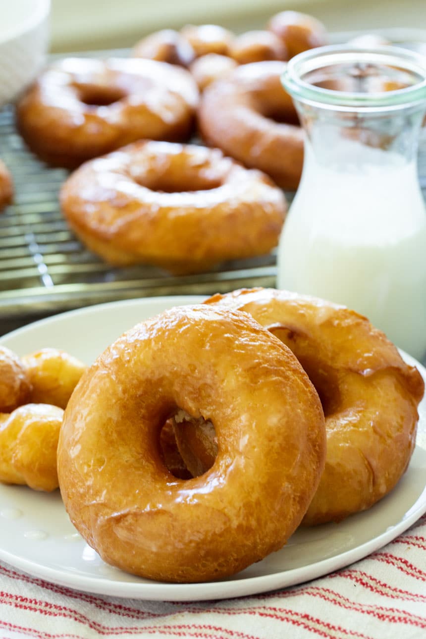 Krispy Kreme copycat doughnuts on a plate with more doughnuts in background.