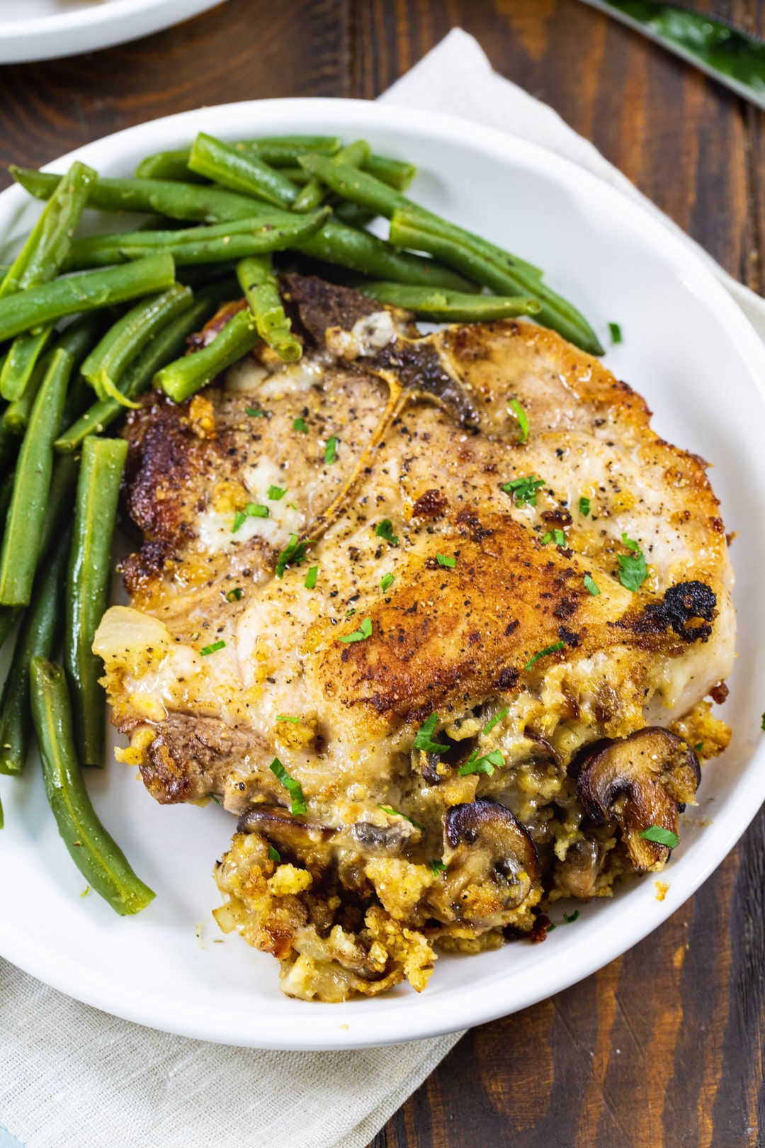 Overhead of stuffed pork chop on a plate.