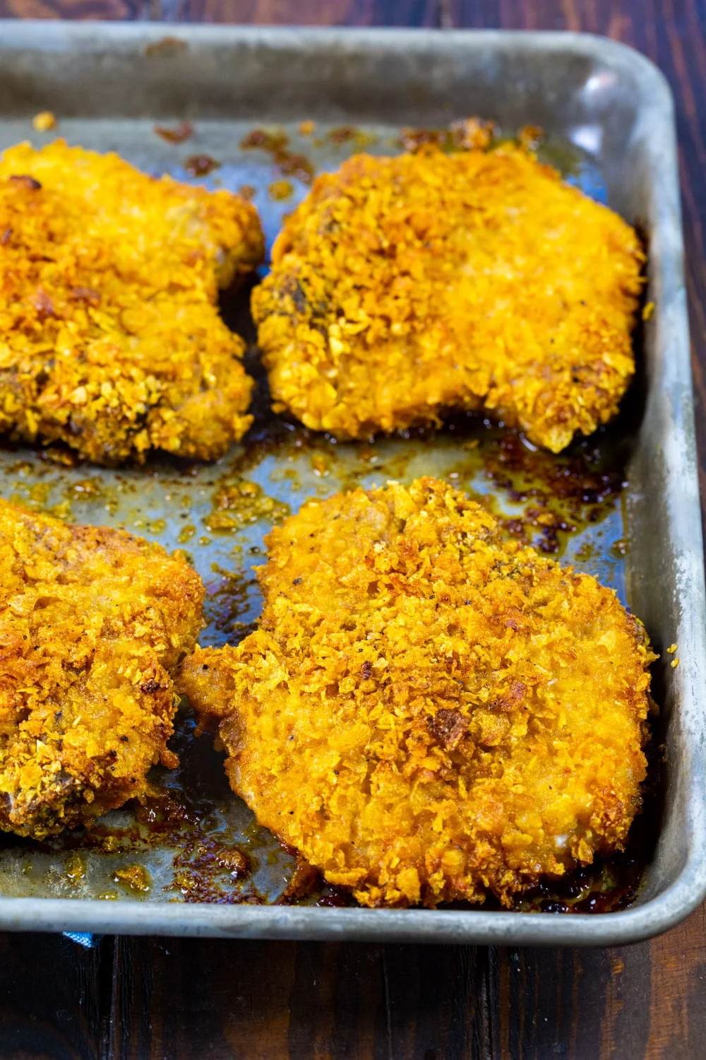 Cornflake Crusted Baked Pork Chops on baking sheet.