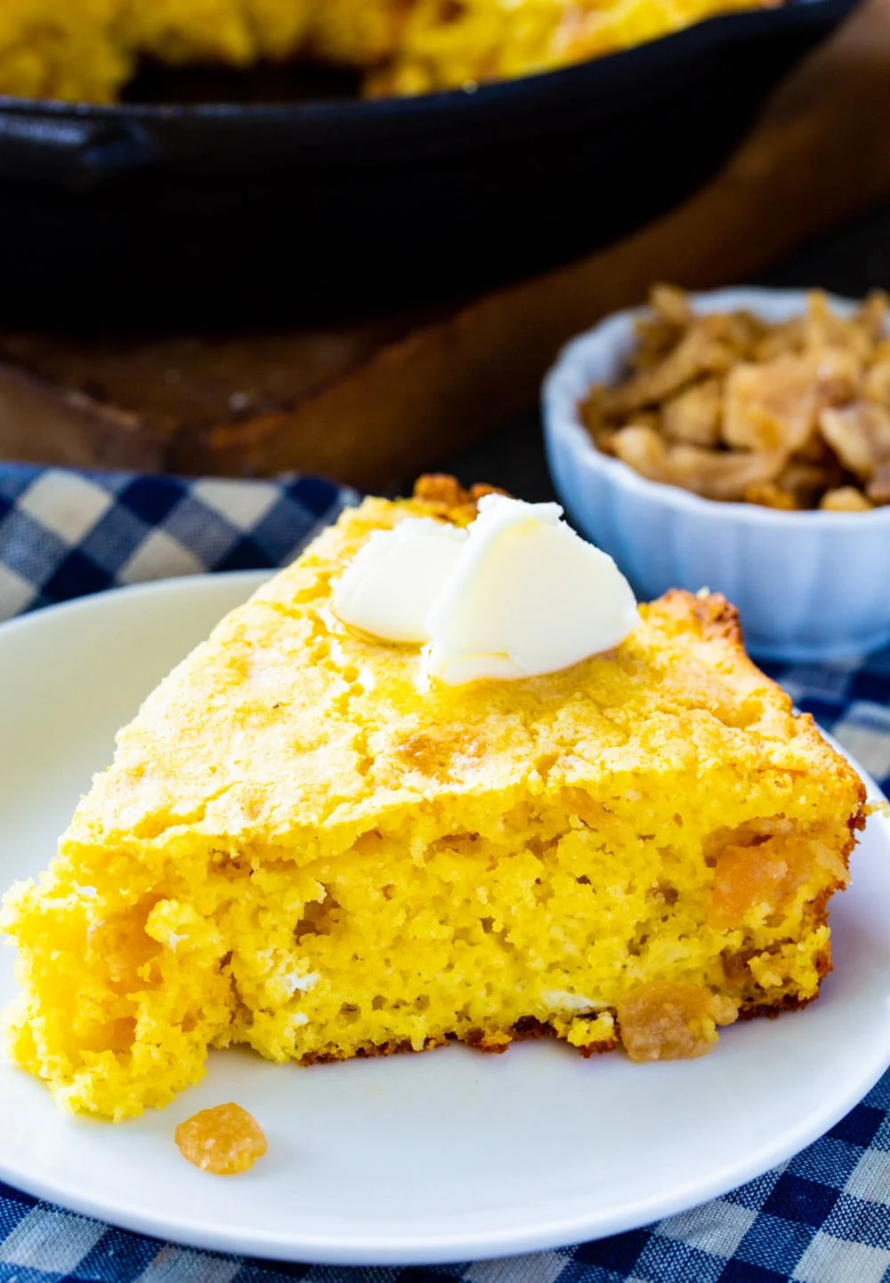 Cornbread with cracklings on a plate.