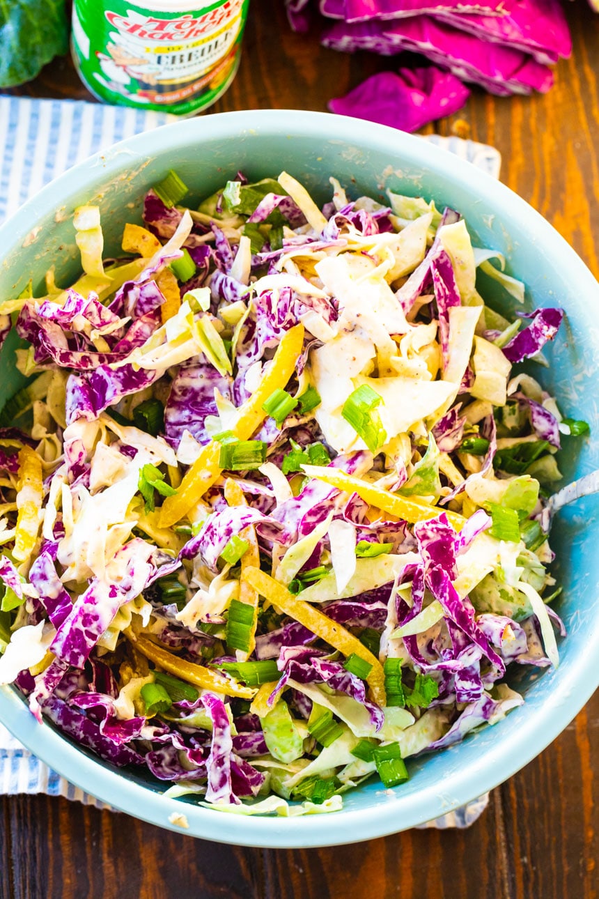 Overhead of Creamy Creole Coleslaw in a large blue bowl.
