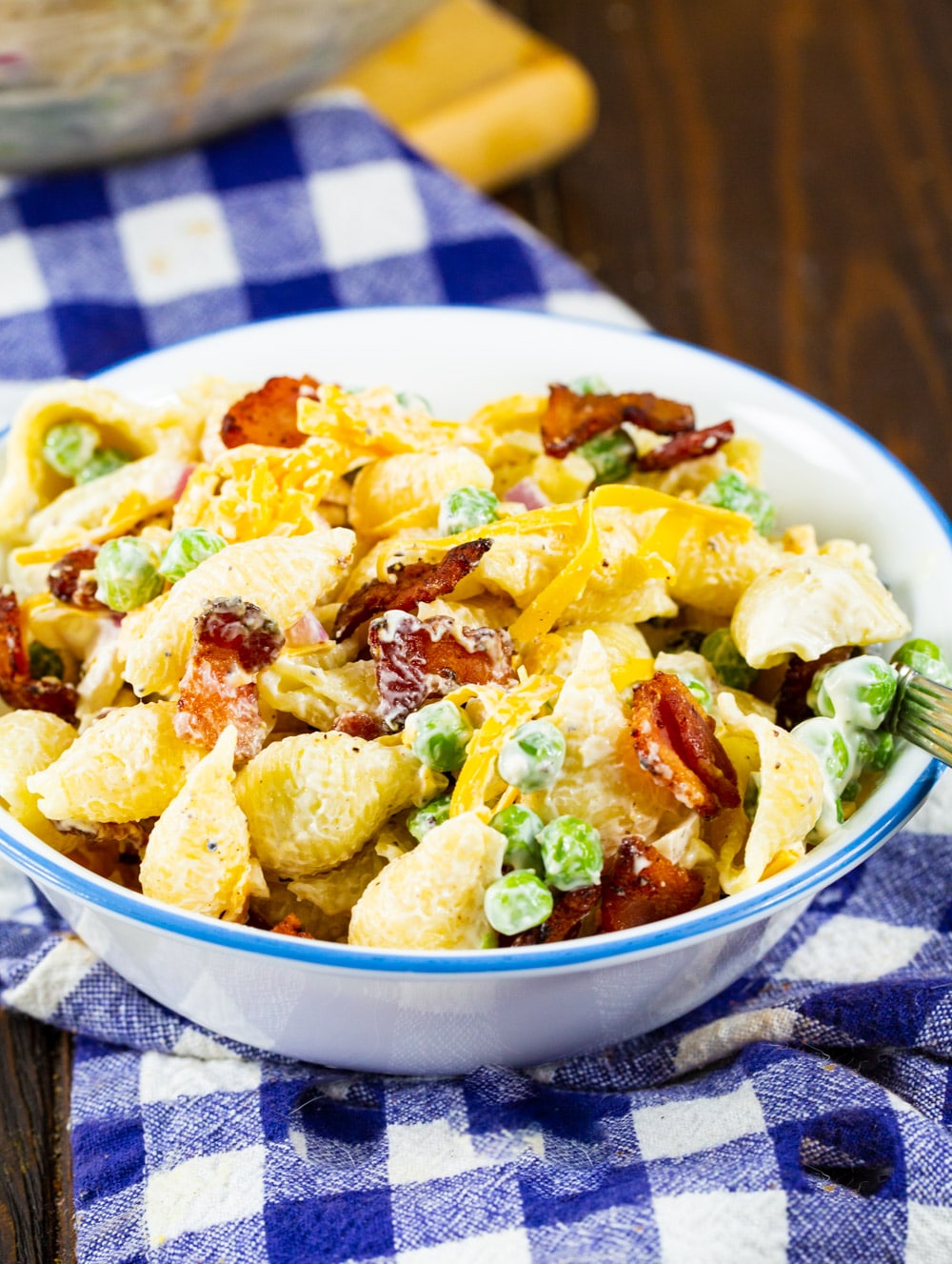 Creamy Pasta Salad with Peas and Bacon in a small bowl.