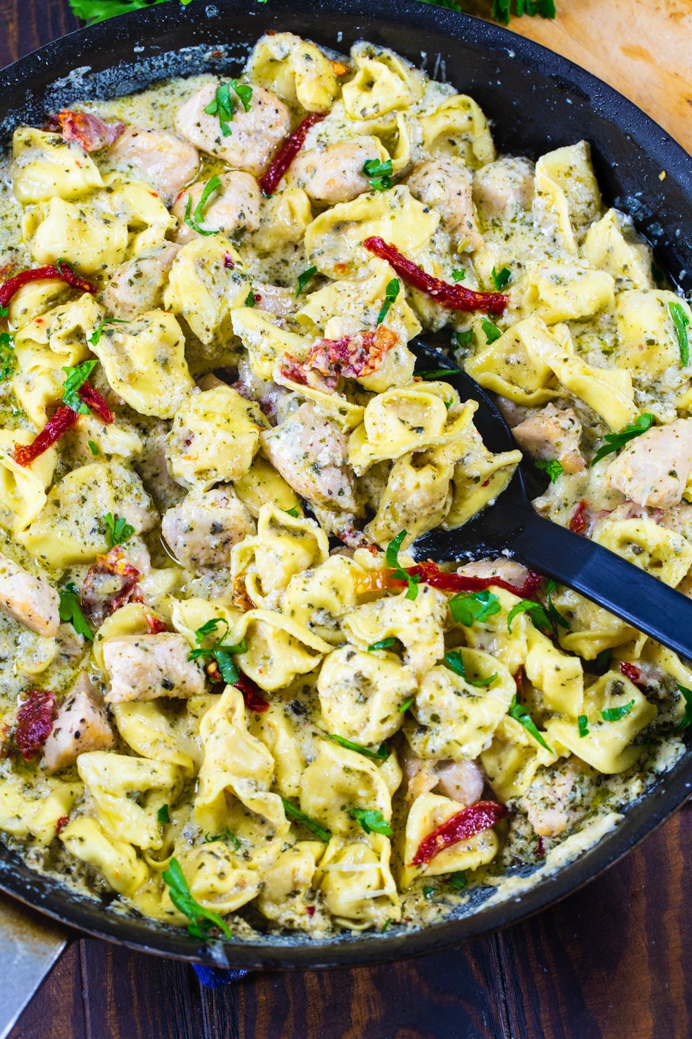 Pesto Tortellini with Chicken in a nonstick pan.