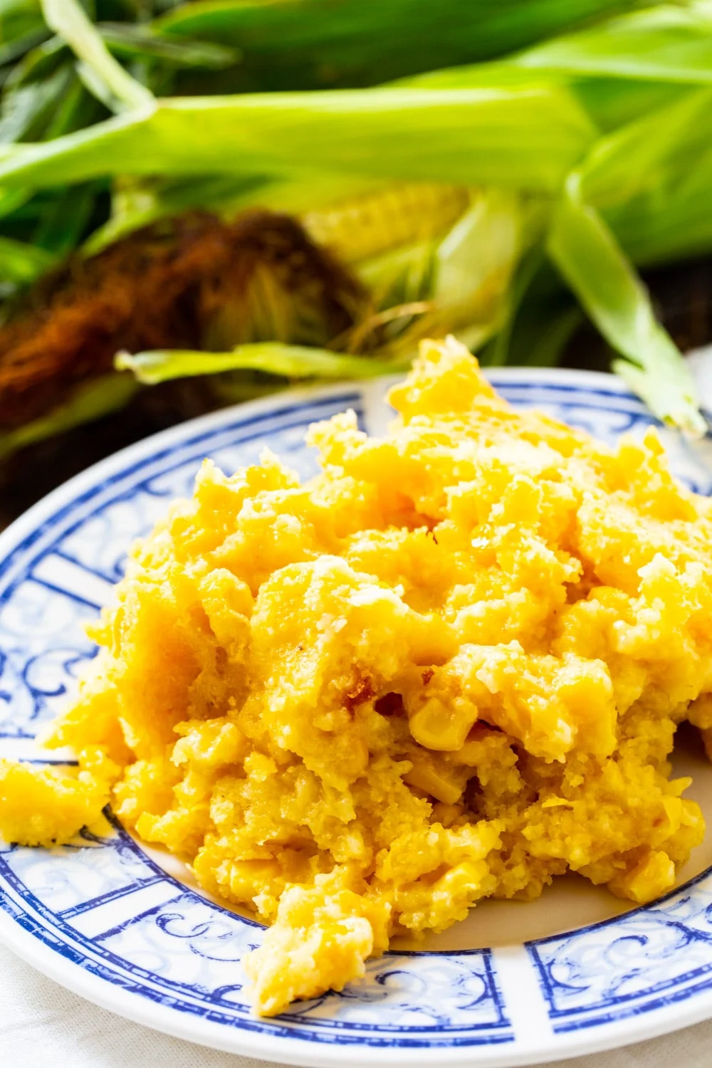 Serving of Crock Pot Corn Casserole on a plate.