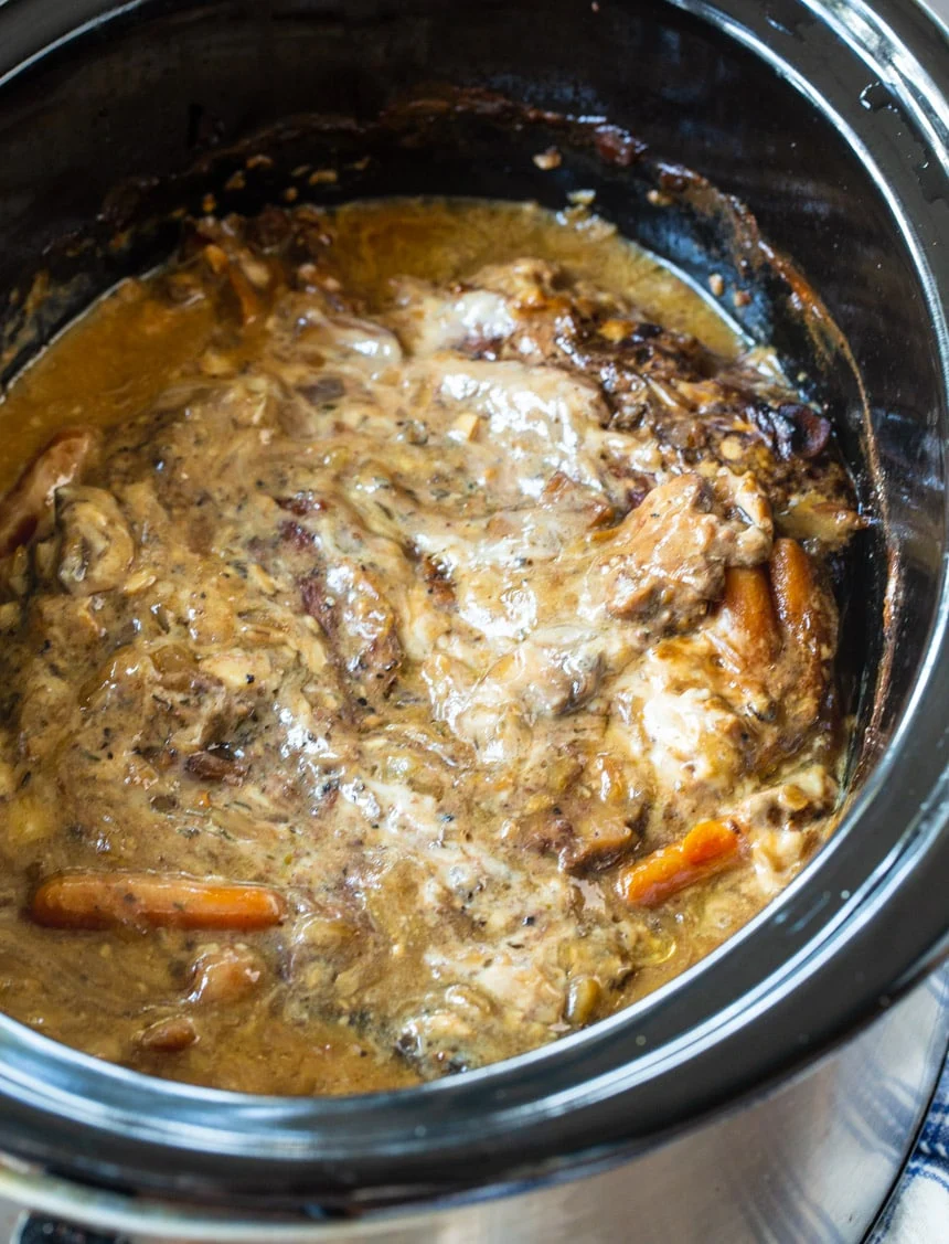 Roast with Mushrrom Gray in a black slow cooker.