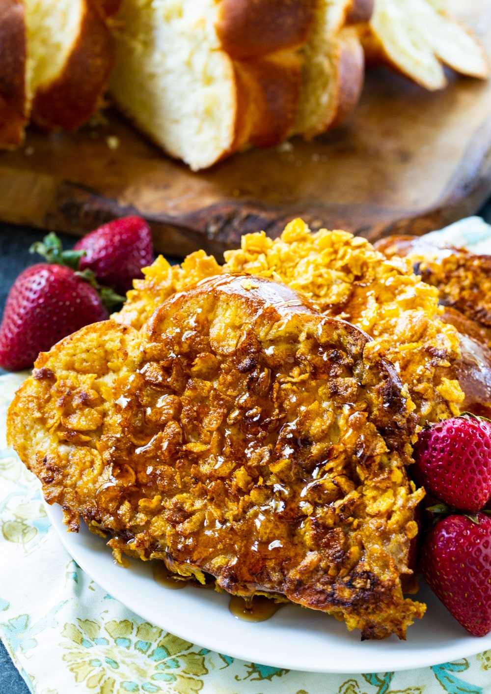 French toast on a plate with bread slices in background.