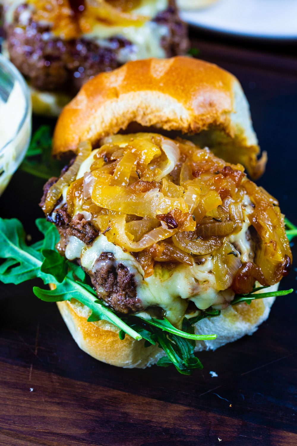 Caramelized onions on top of burger.