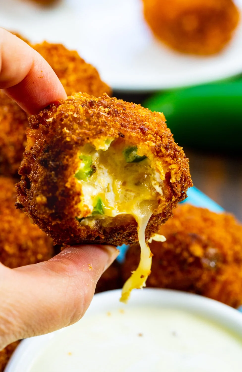 Hand holding a Fried Jalapeno Popper Bite