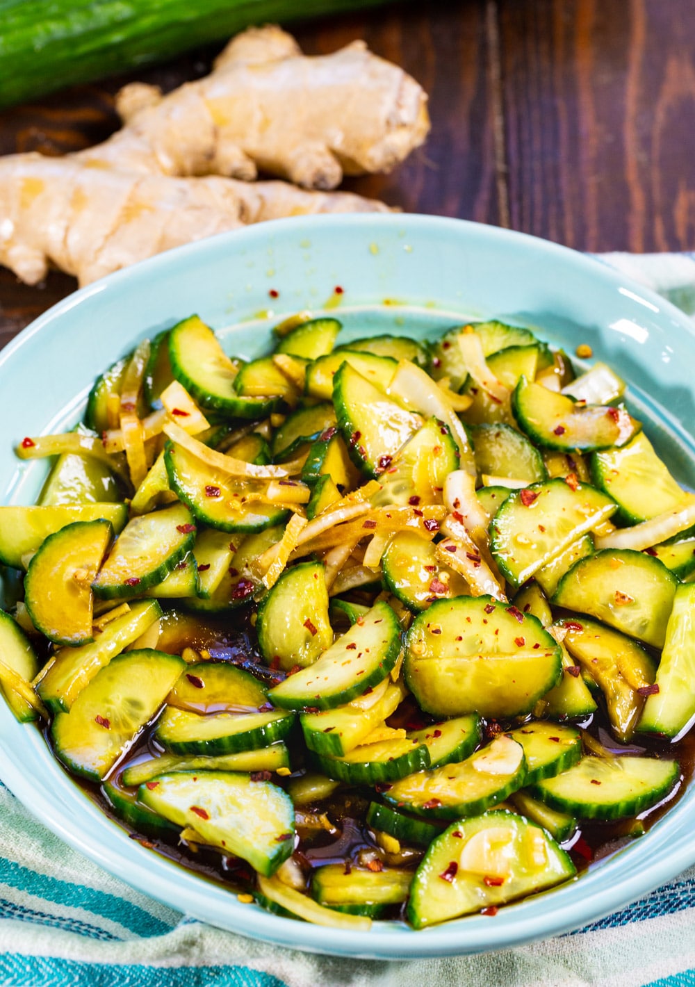 Ginger Sesame Cucumbers in blue bowl.