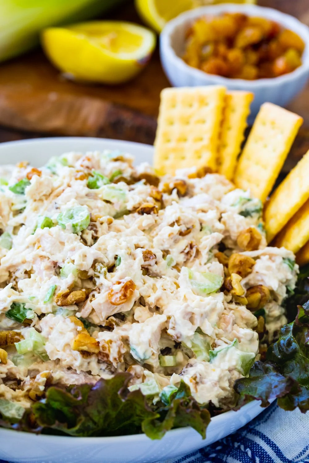 Chicken Salad on a bed of lettuce in serving bowl.