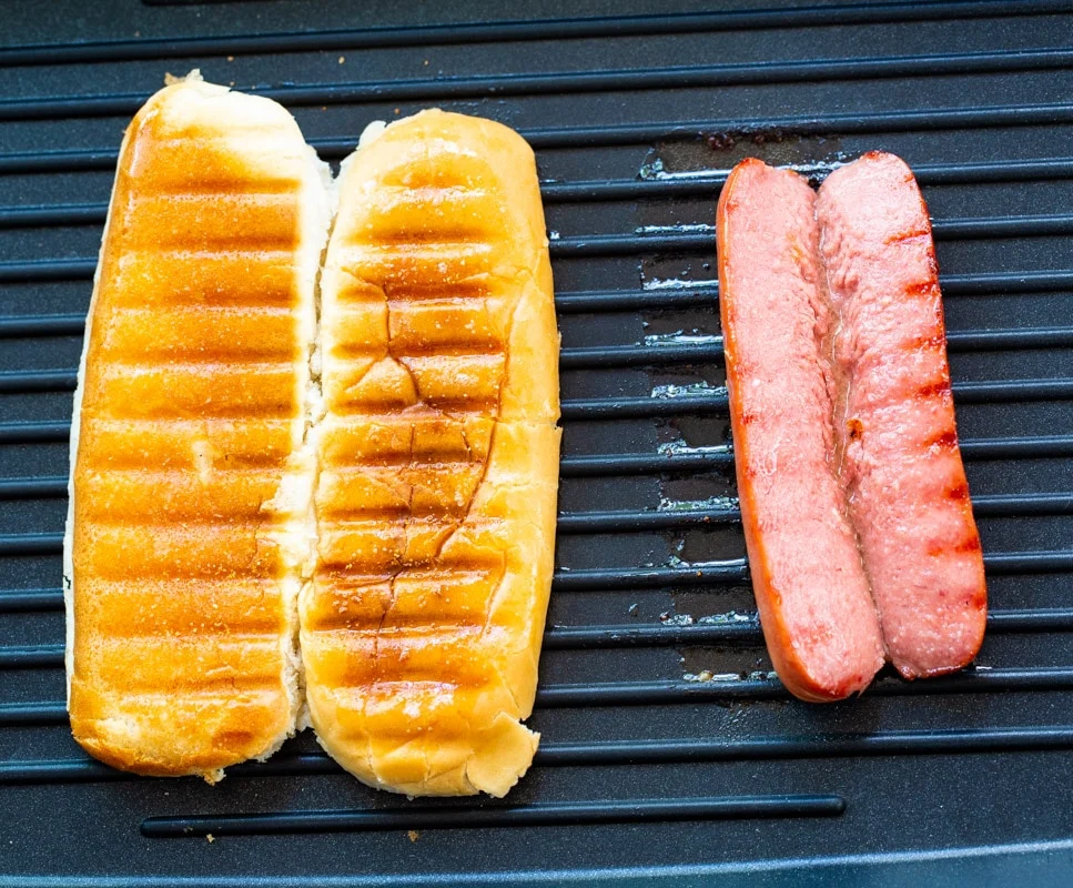 Grilled bun and a grilled hot dog.