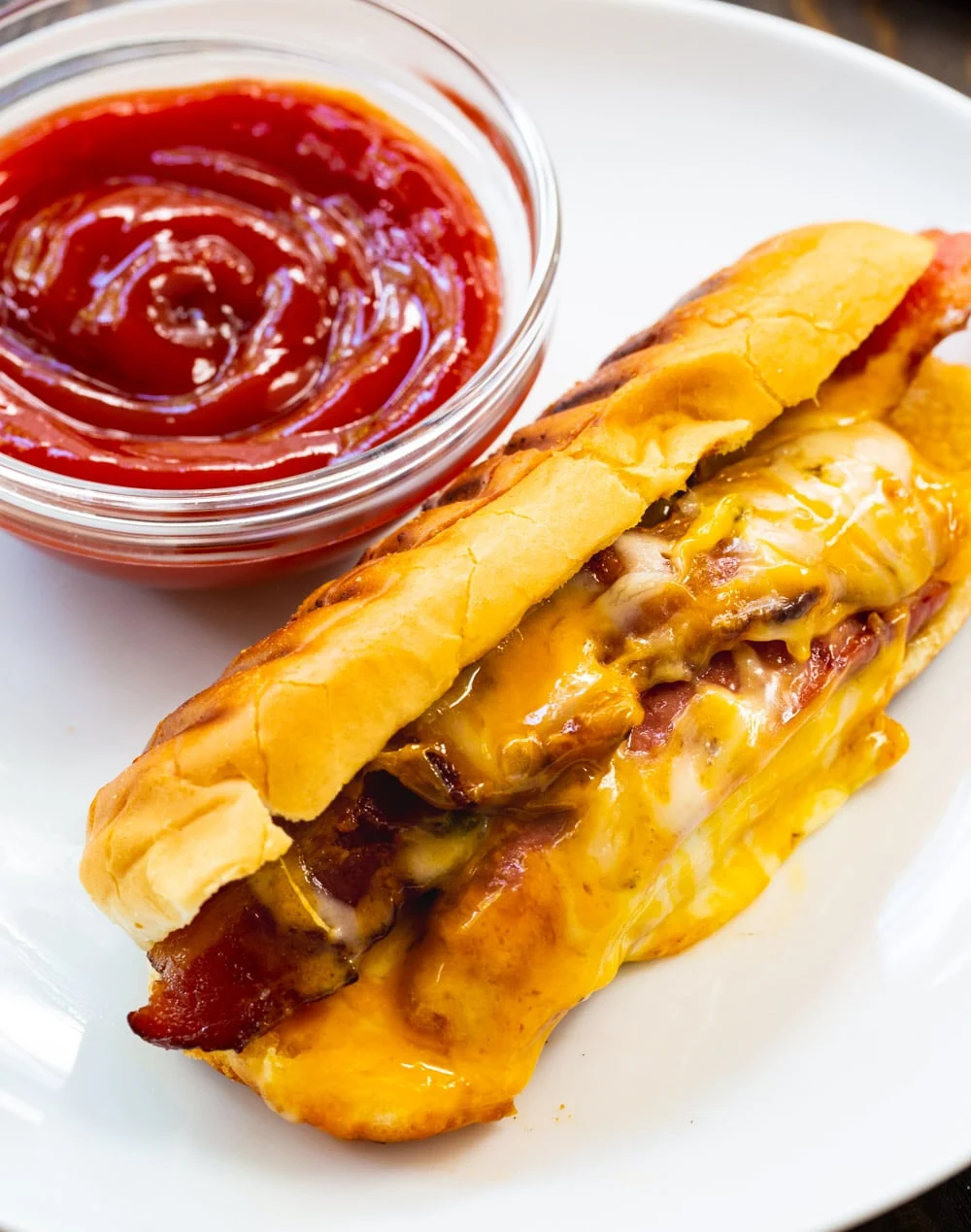 Grilled Cheese Hot Dogs on a plate with ketchup.
