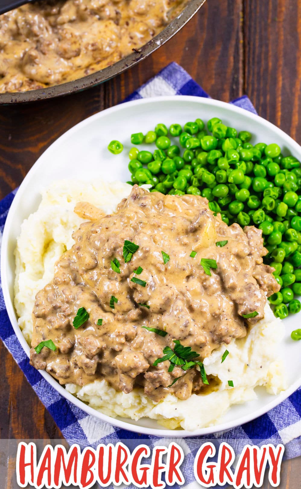 Easy Hamburger Gravy over mashed potatoes with peas.