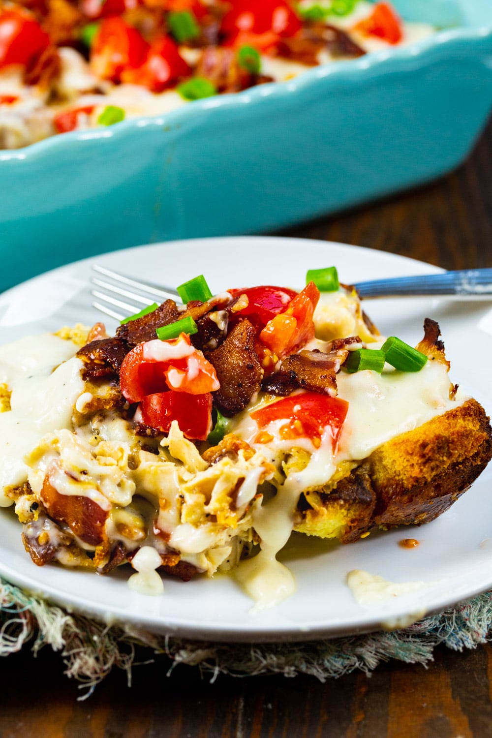 Slice of casserole on a plate.