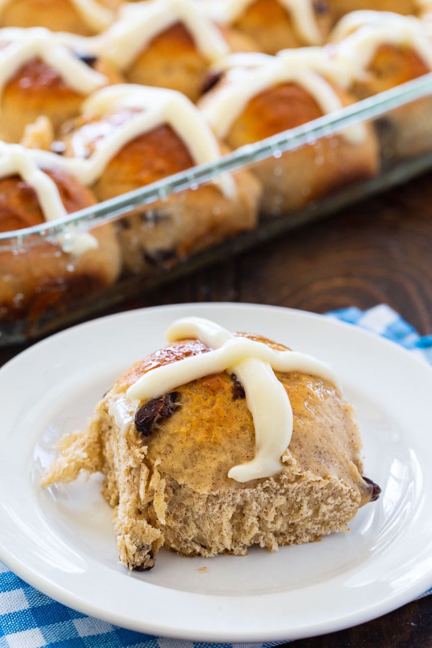 Single Hot Cross Roll on a plate.