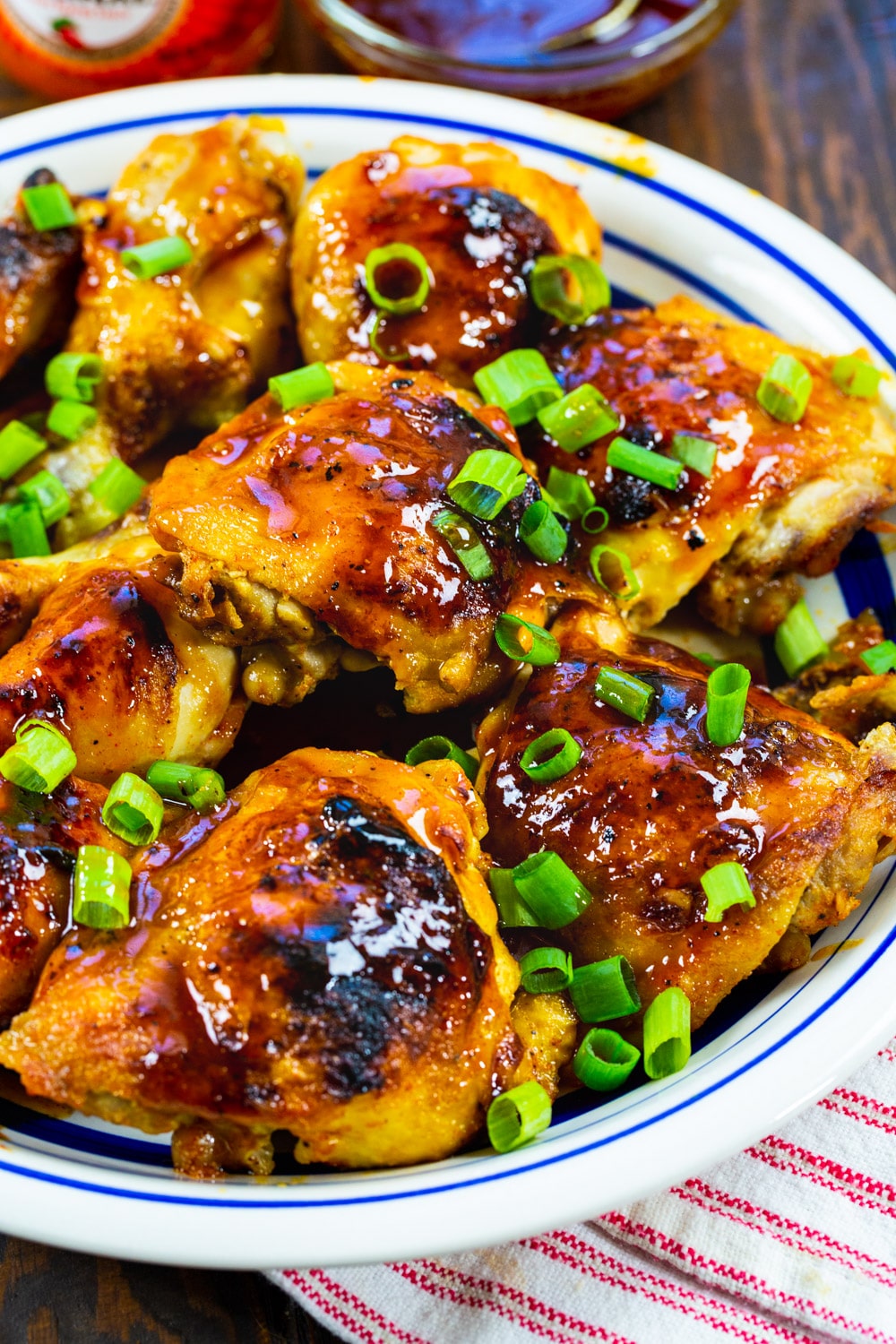 Cooked chicken topped with green onions.