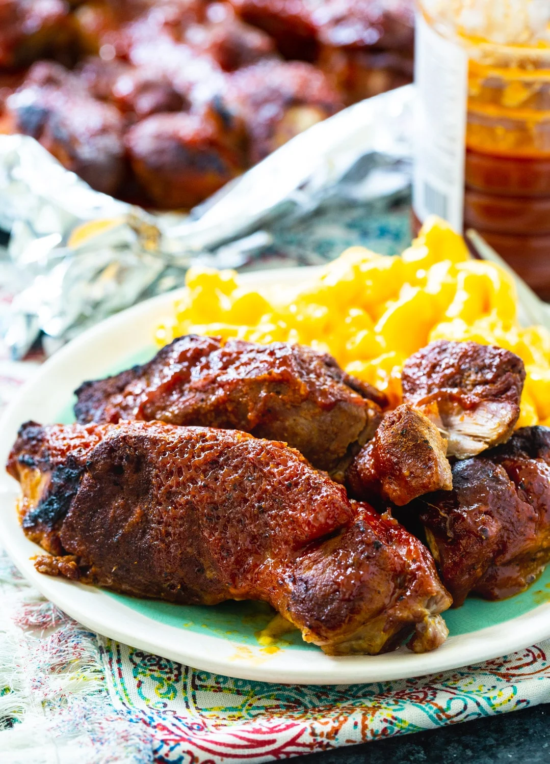 Instant Pot Country Style Ribs on plate with mac and cheese.