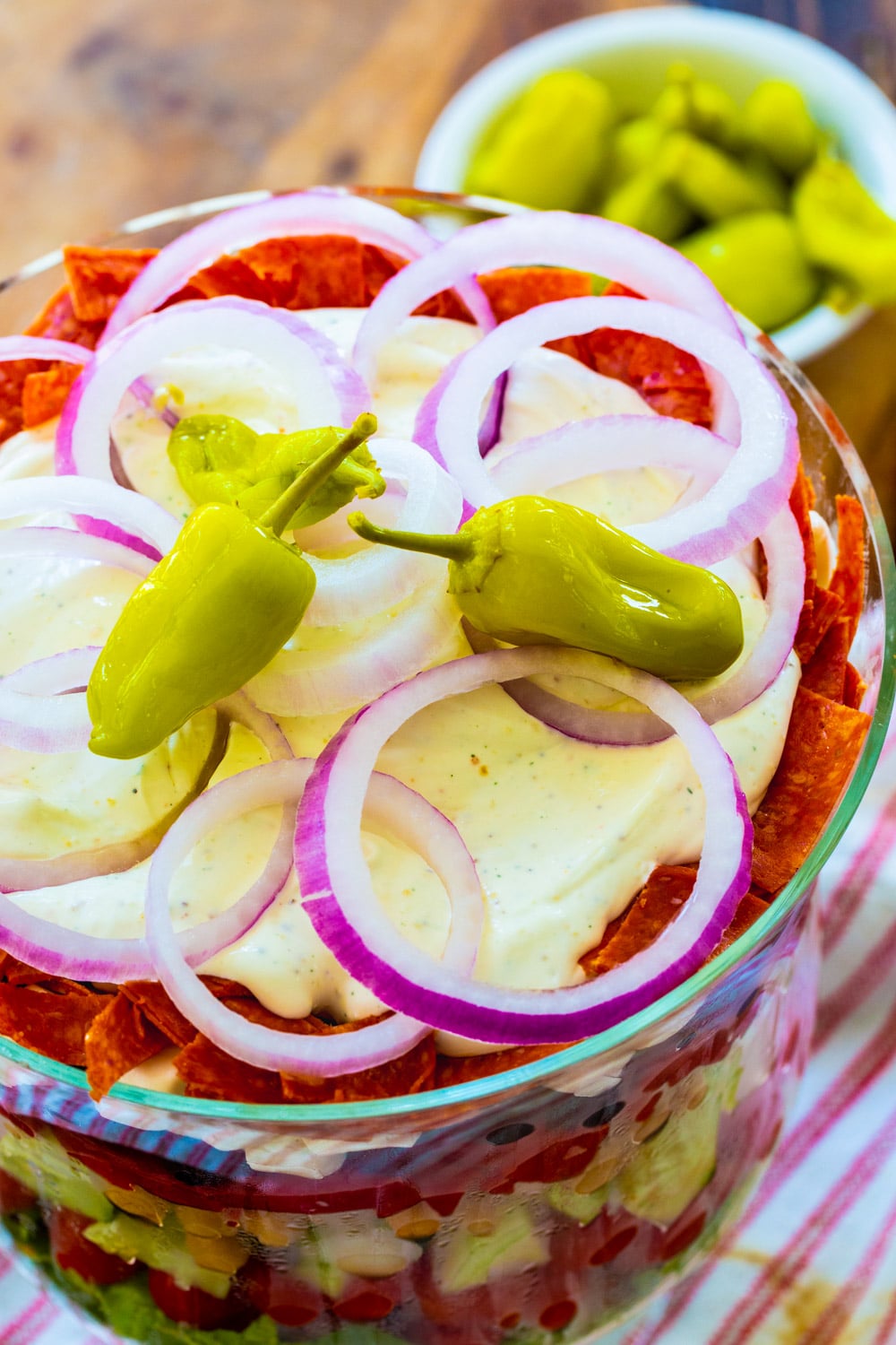 Top of the layered salad with pepperoncini peppers.