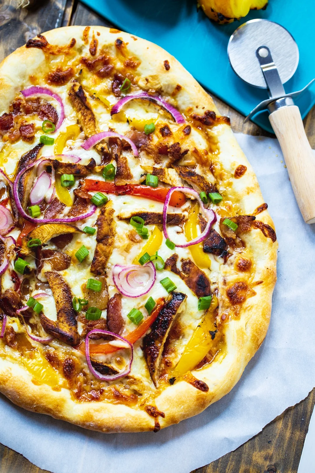 Whole Pizza on parchment paper.