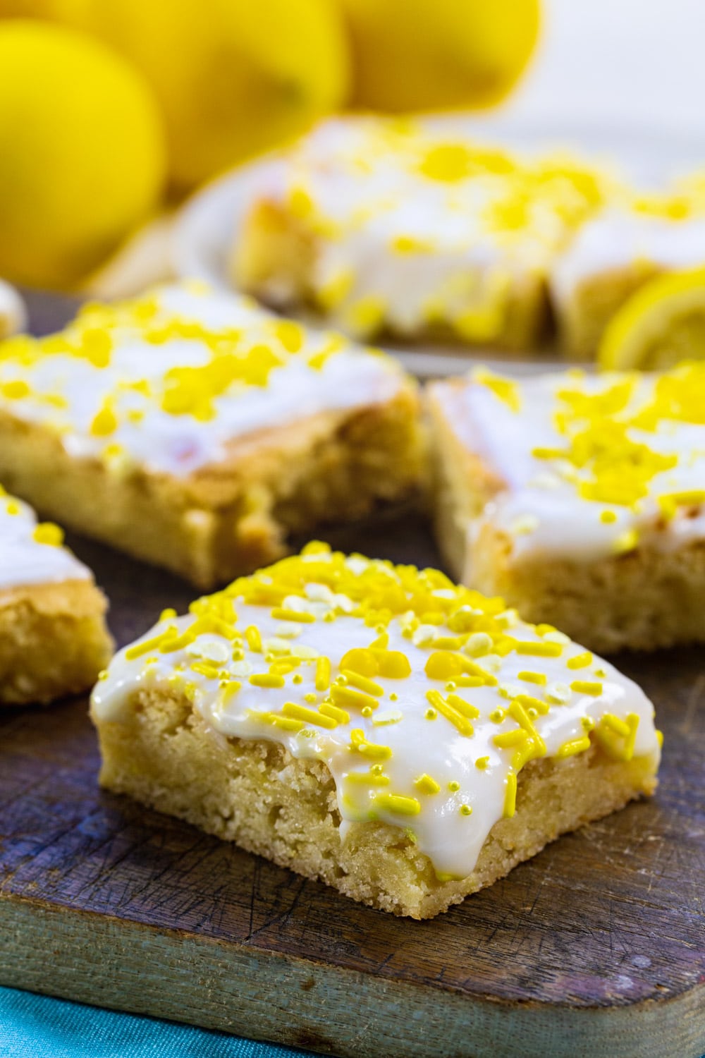 Lemon Cookie Bars topped with glaze and sprinkles.