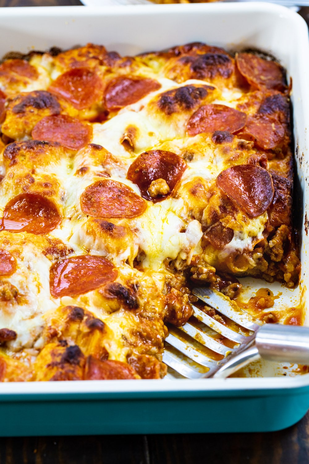 Meat Lovers Bubble Up Pizza with a piece cut out.