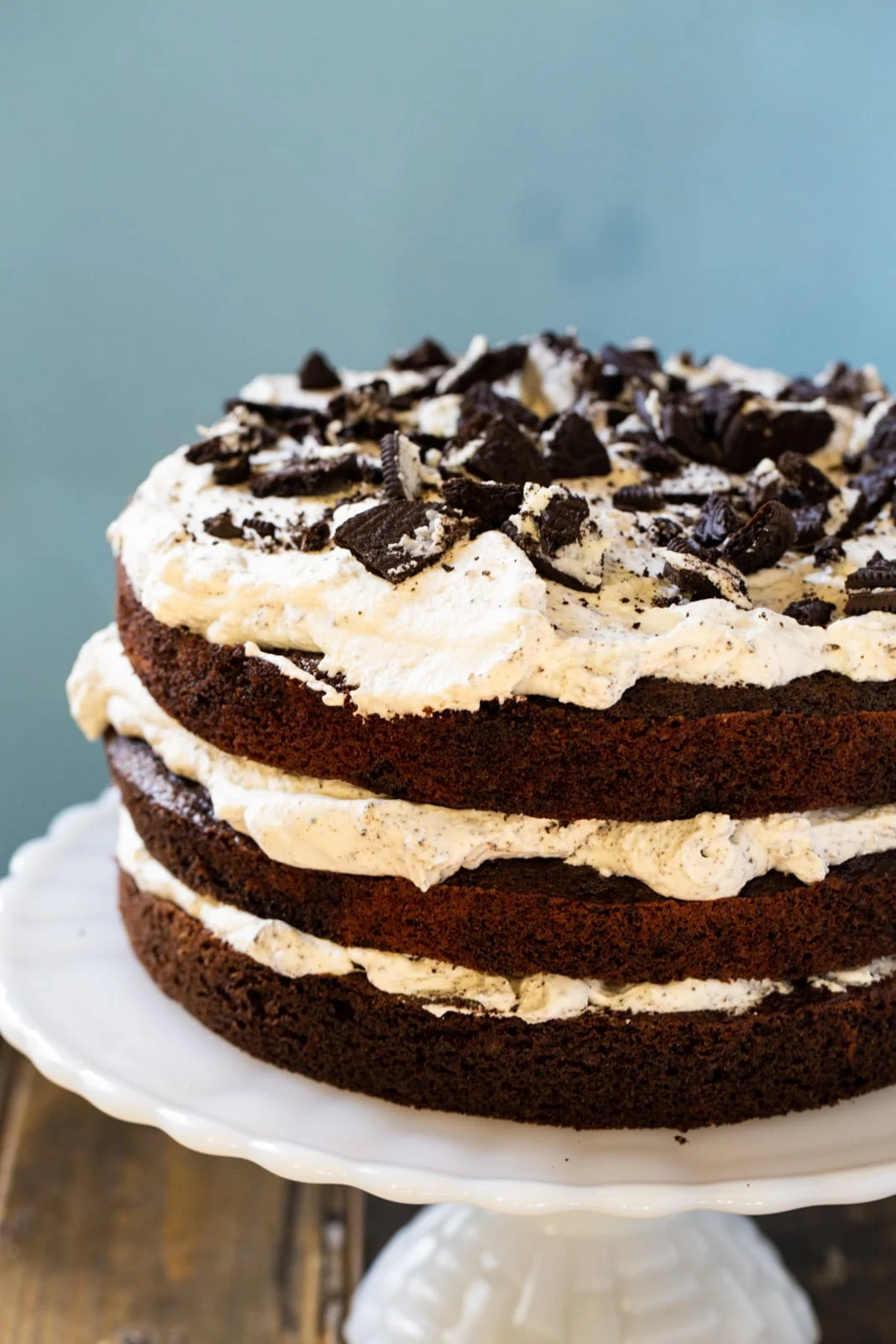 Three layer cake on cake stand.