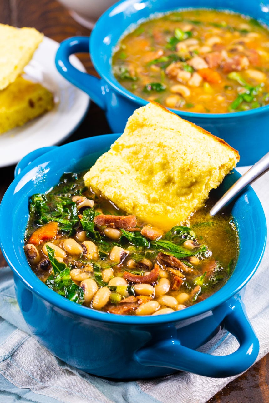 Black-Eyed Pea Soup with Collard Greens in soup bowls.