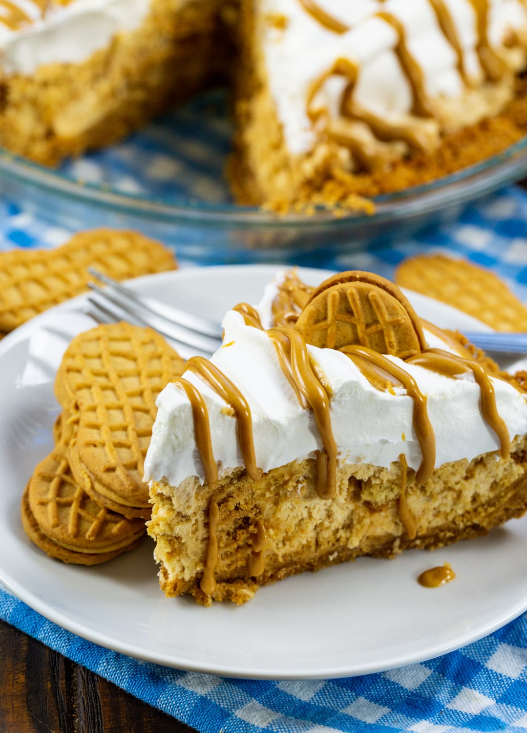Slice of pie on a plate with 2 Nutter Butter cookies.