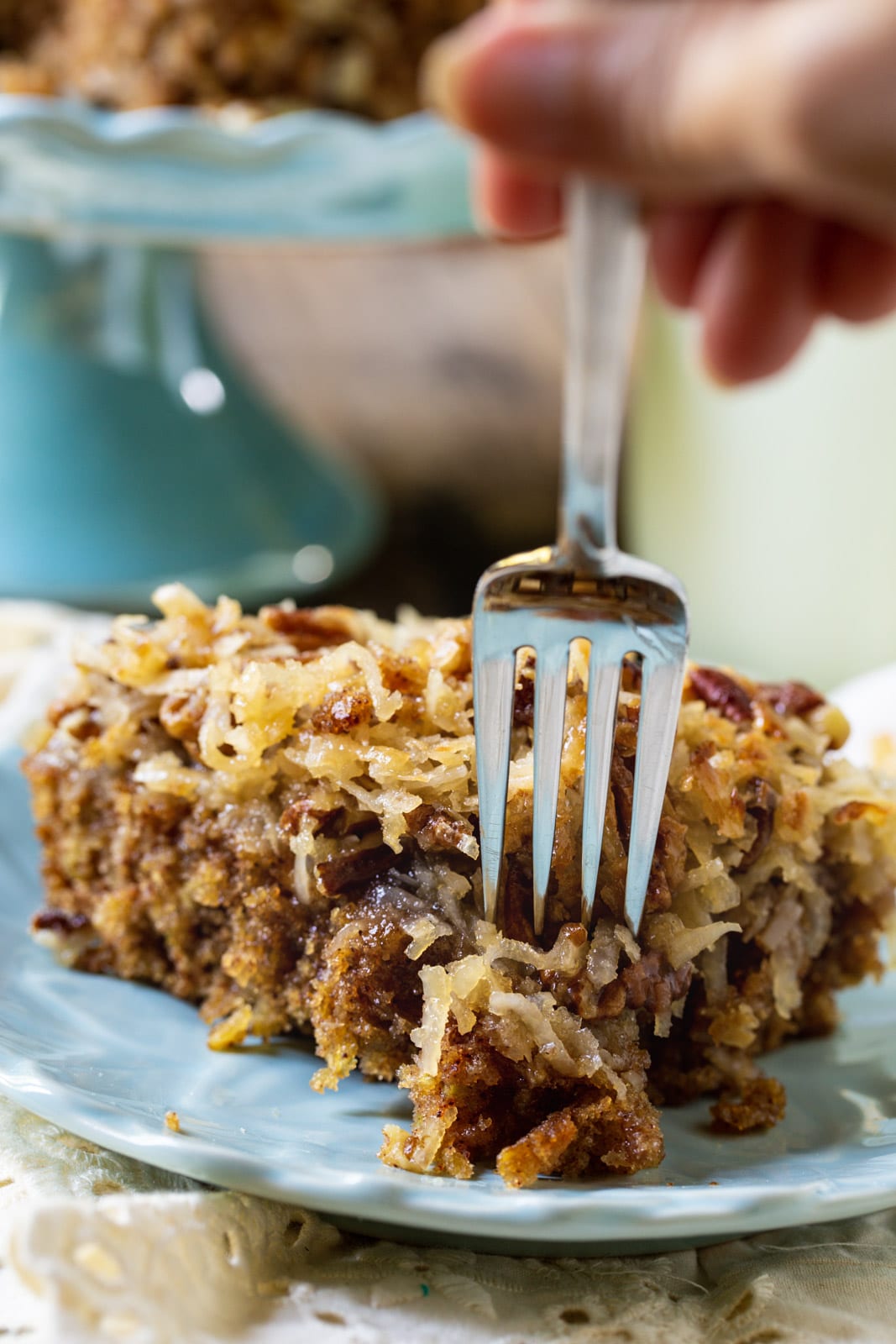 Fork with piece of cake on it.