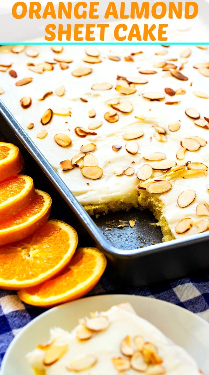 Orange Almond Sheet Cake surrounded by fresh orange slices