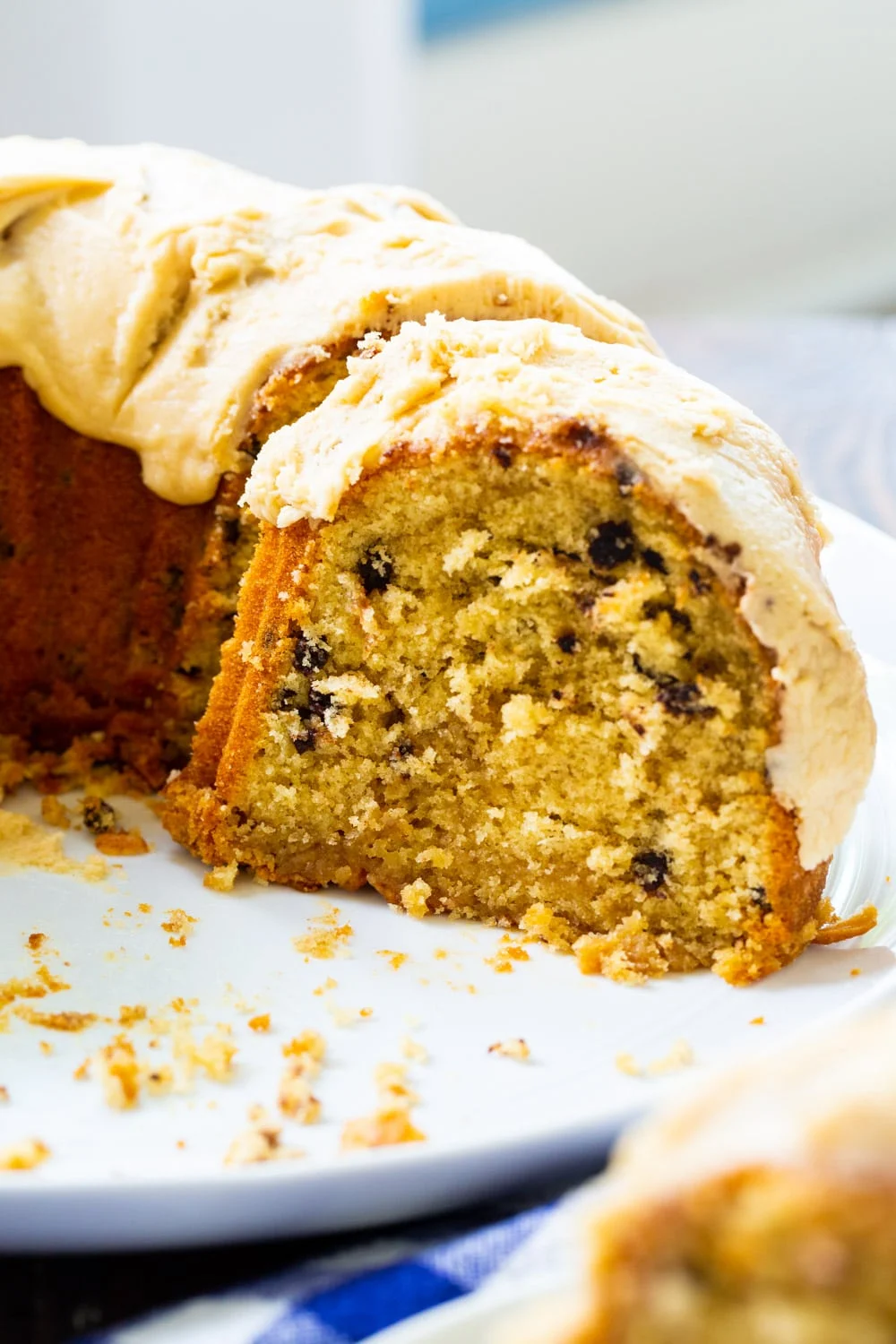 Half of Bundt Cake on a serving platter.