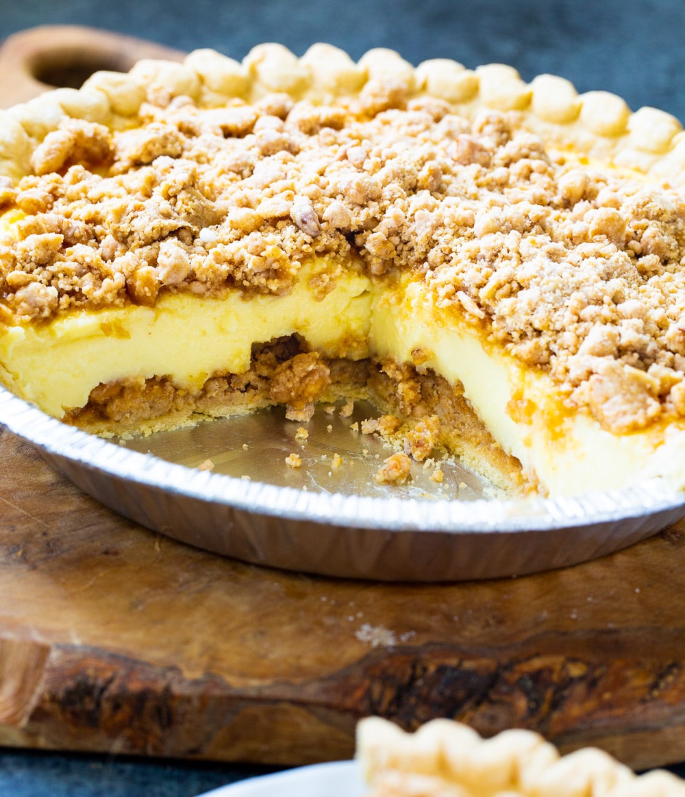 Peanut Butter Pie in a pie plate with slice cut out.