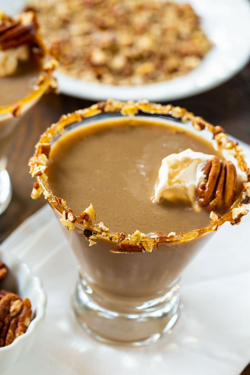 Pecan Pie Martini with caramel sauce and pecans on rim.