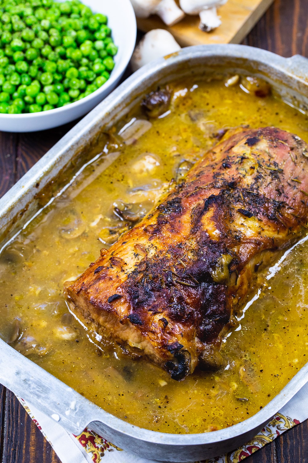 Roasted Pork Loin in roasting pan.