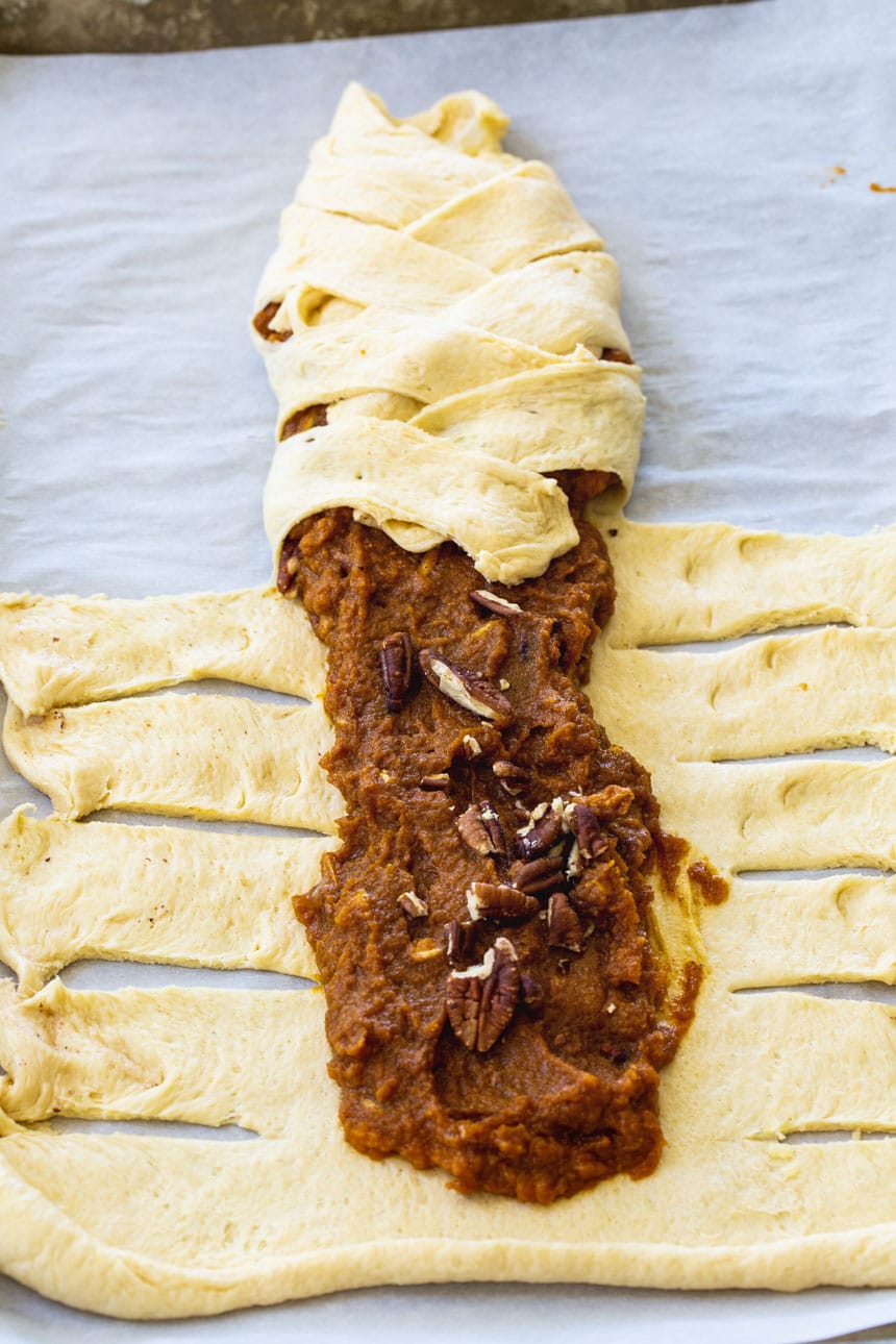 Crescent dough being wrapped around filling.
