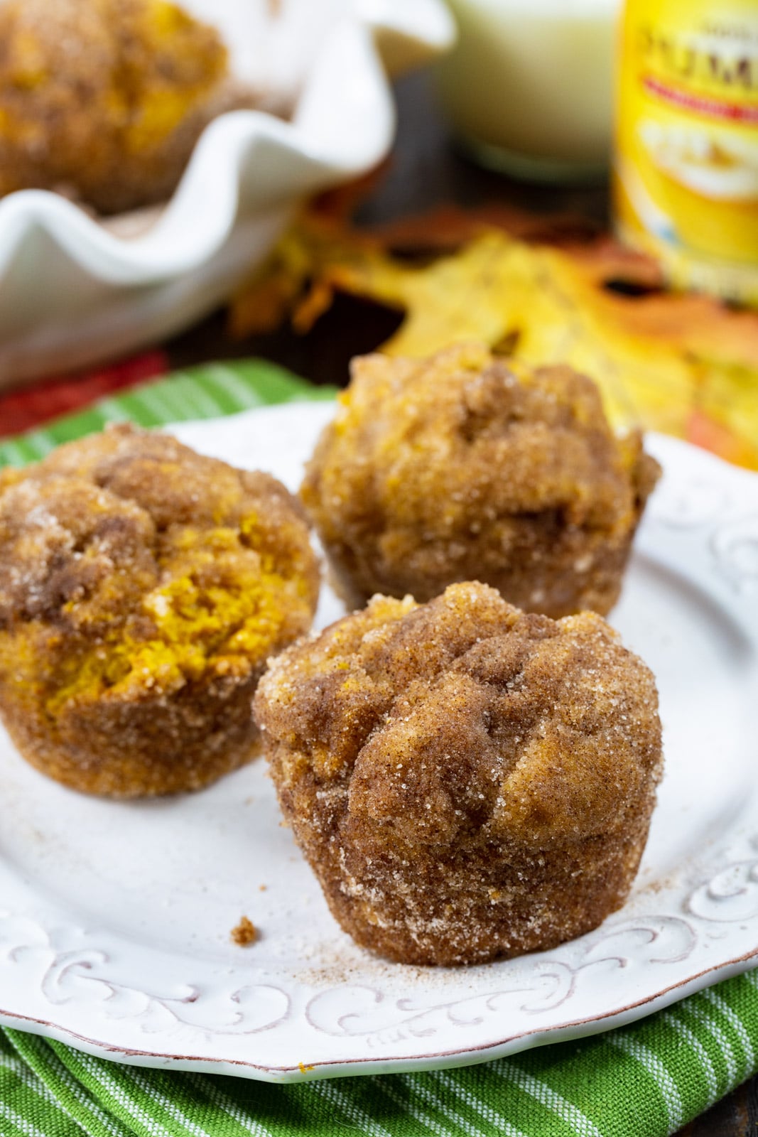 Three muffins on a plate.