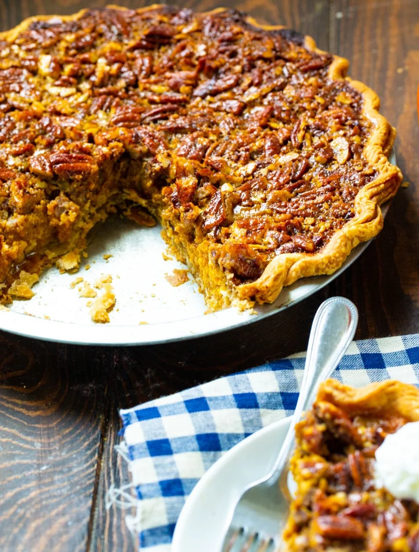 Pumpkin Pecan Pie with a slice cut out.
